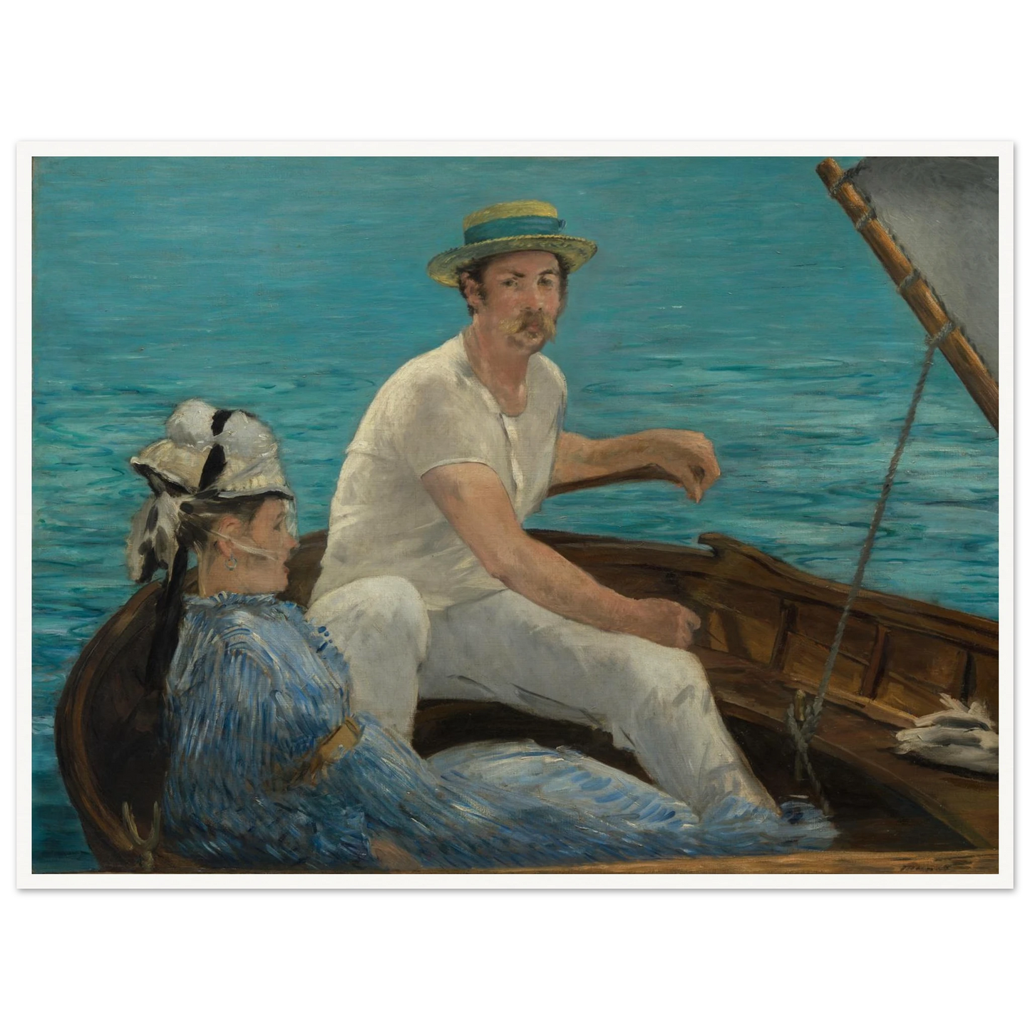 Man and woman sit in a small boat on bright blue water under a gray sail
