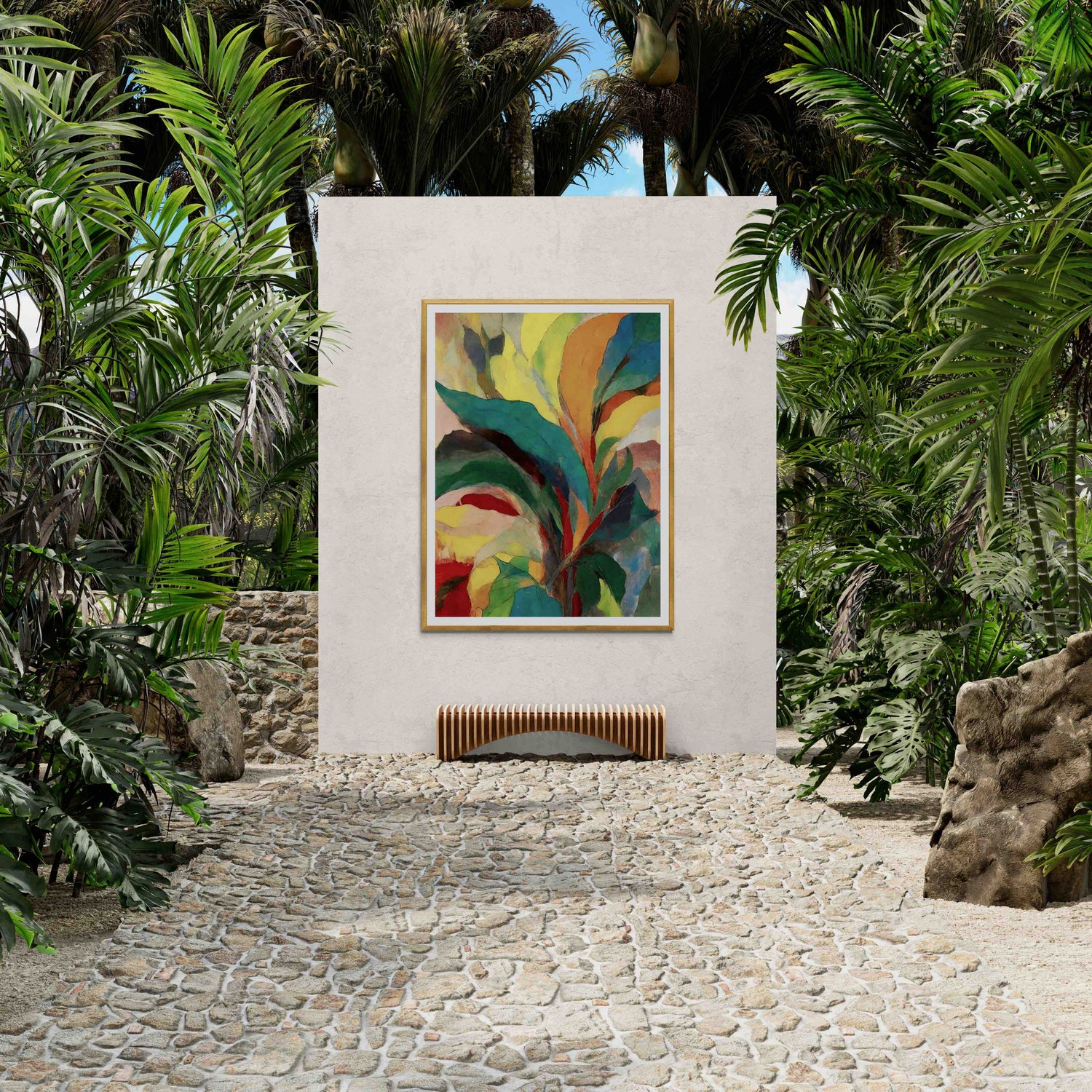 Outdoor stone path surrounded by lush greenery, featuring vibrant abstract tropical leaf wall art framed on a white wall with a bench below.